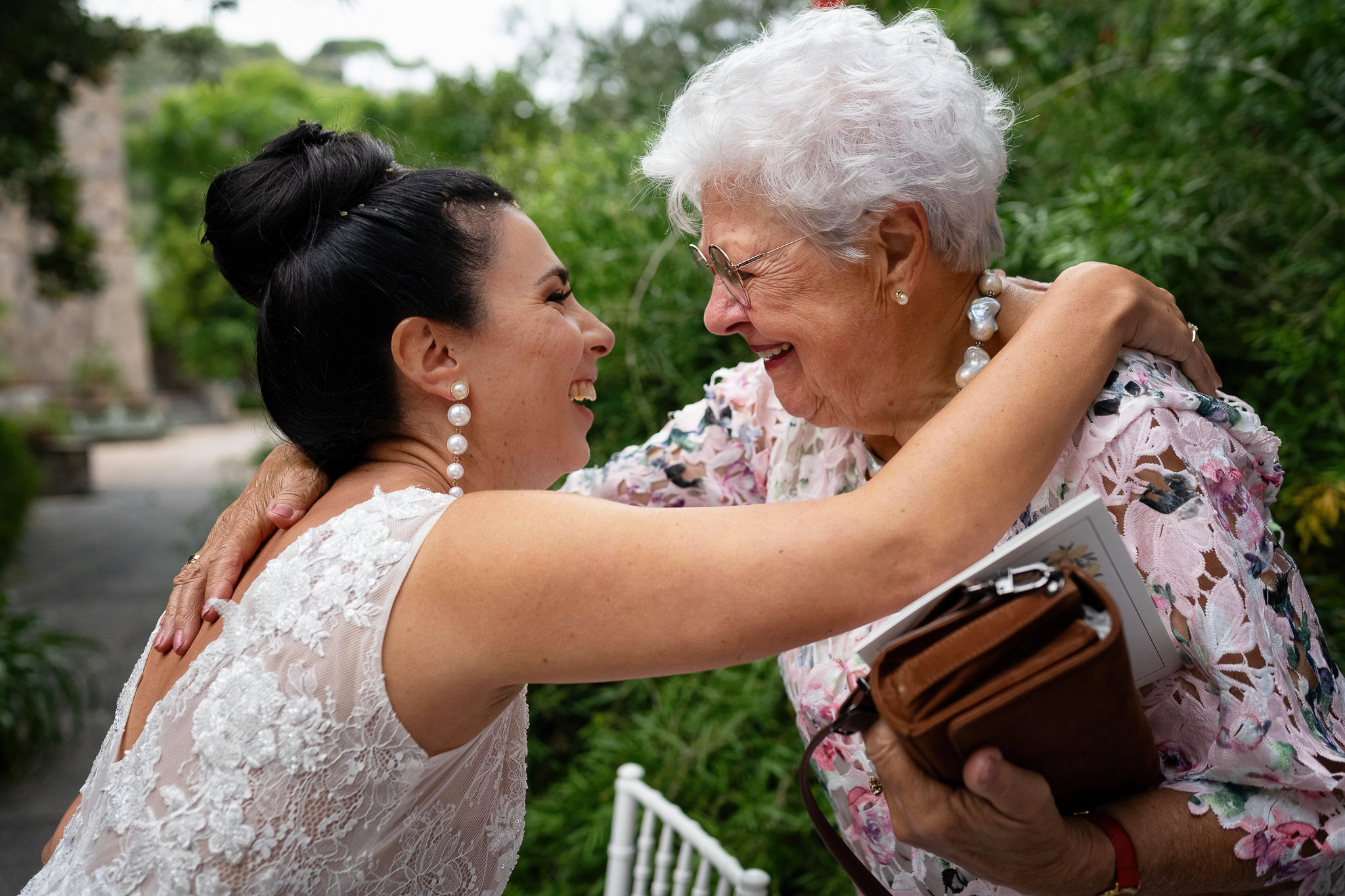 Groom's grandmother greeting bride after the ceremony
