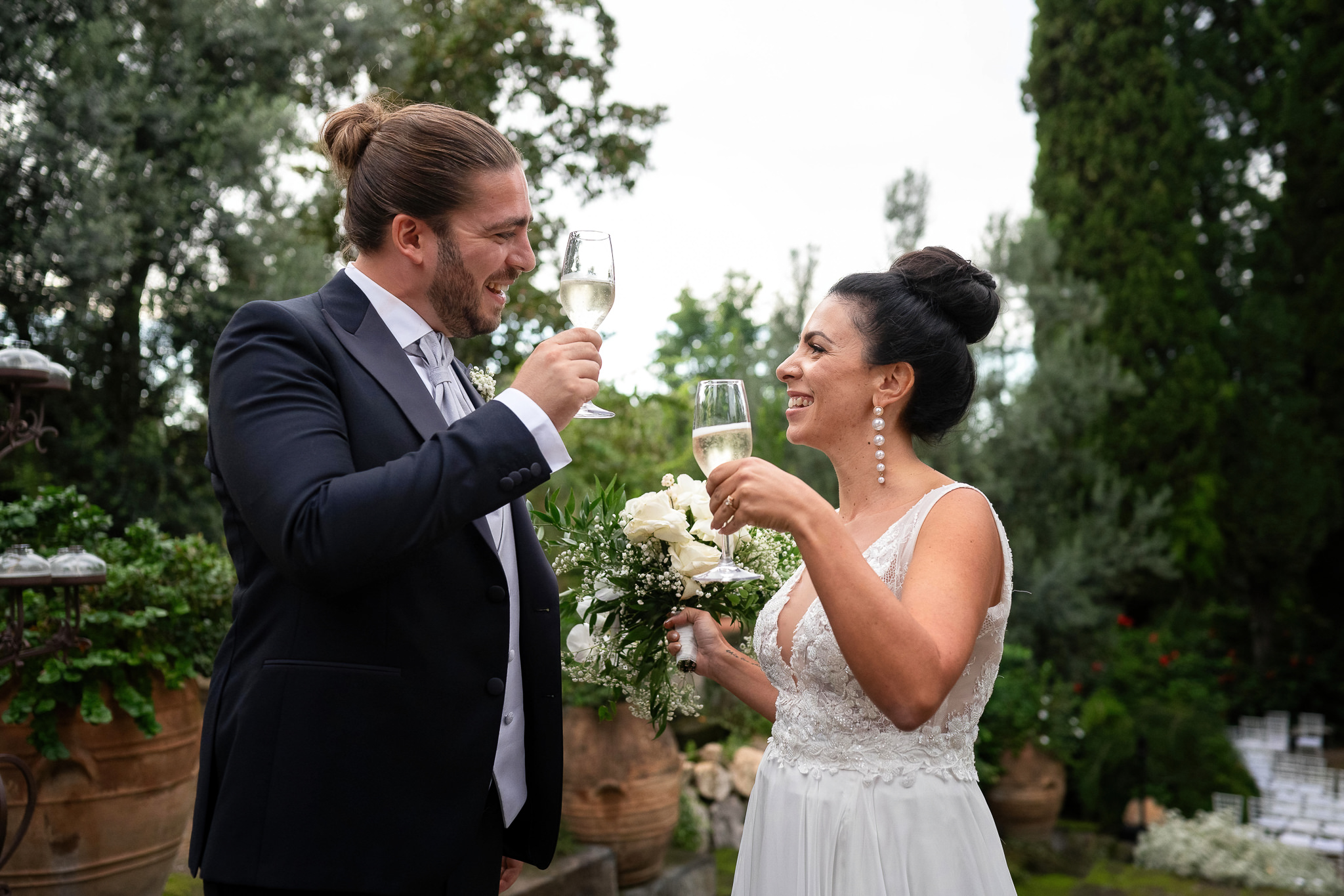bride and groom cheers to their crowned dream